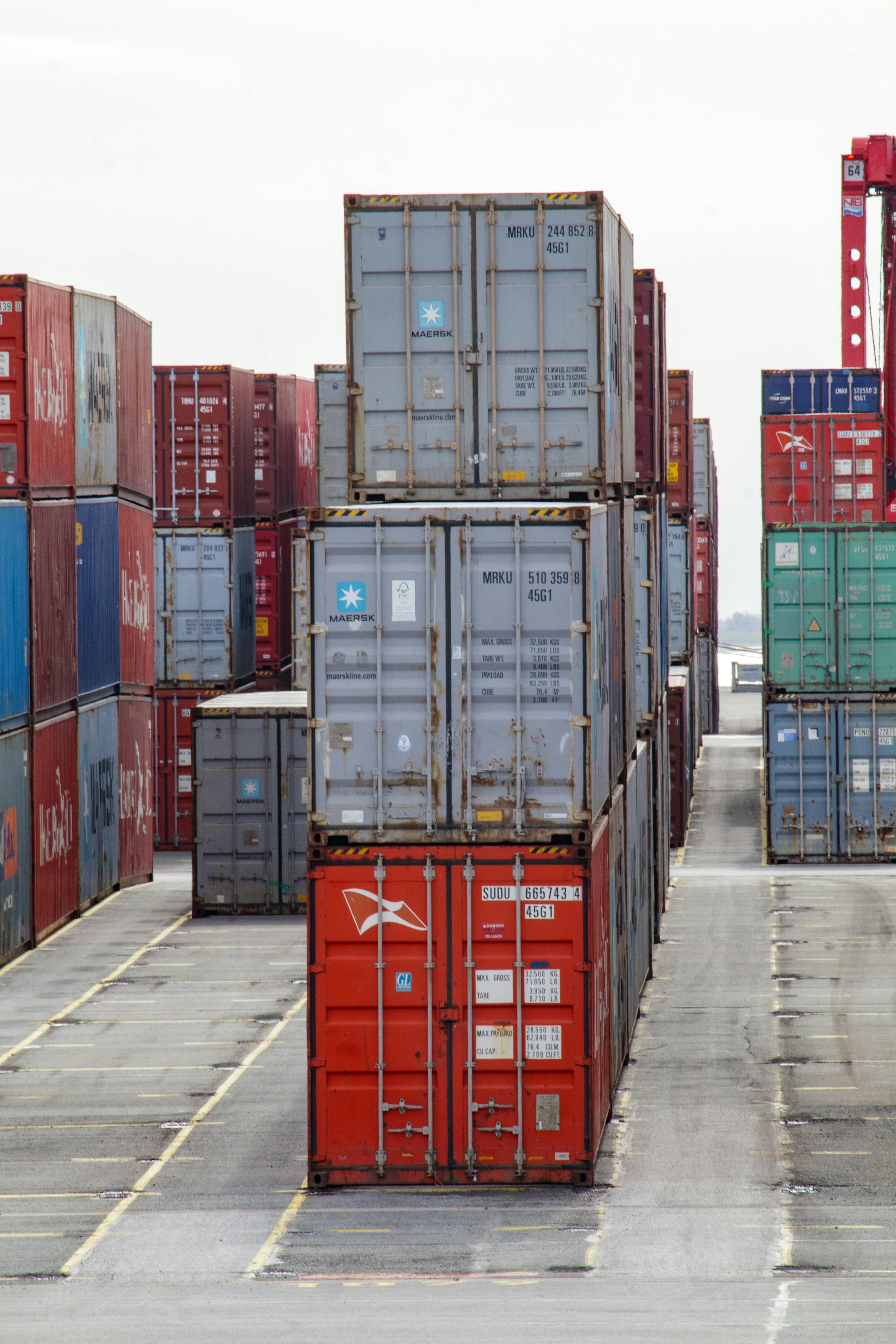 Stacked shipping containers used as a visual metaphor for Docker container images and repeatable releases.