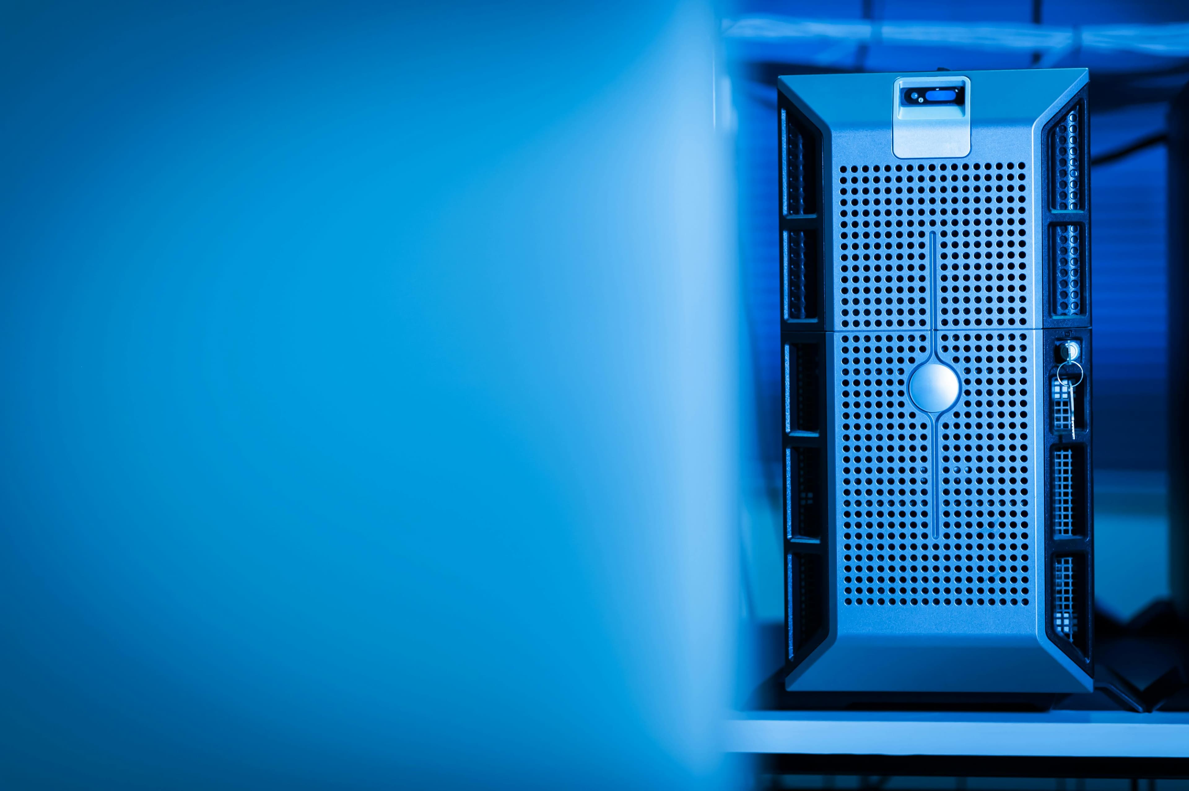 A blue-lit server rack representing a production hosting environment prepared for safer releases.